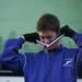 Ann Arbor Pioneer Senior Galen Burrell puts on  his medal while on the podium during the MHSAA Division One award ceremony on Saturday. Burrell finished 11th. Daniel Brenner I AnnArbor.com
